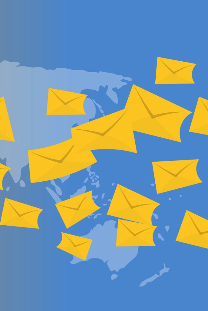 Yellow envelopes flying over a world map.